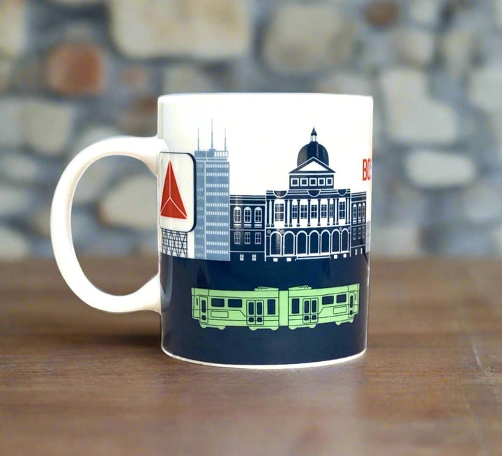 Right side view of Boston Landmark Skyline and Green Line Subway Mug on Wood counter top