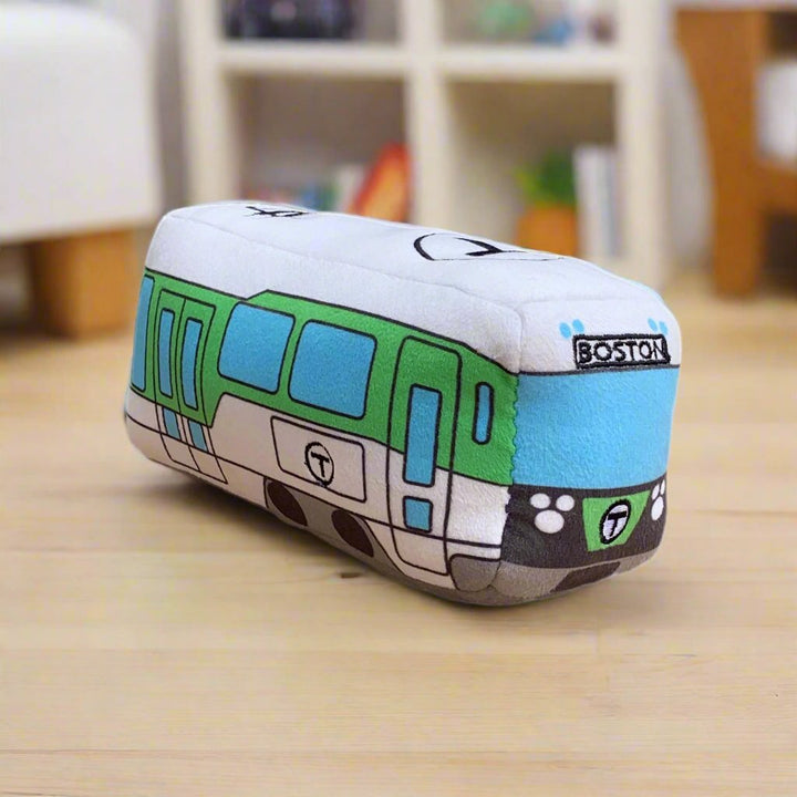 Cute Boston Green Line trolley toy on the floor in a kids' room